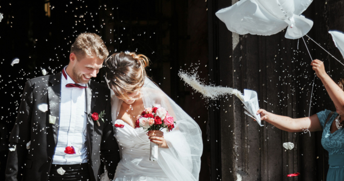 Bride and groom going out of church